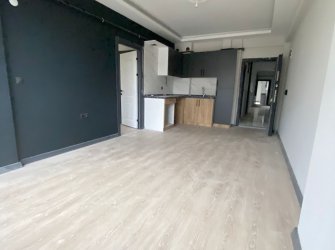 SAMSUN ATAKUM KURUPELİT MH 1+1 1.KAT GENİŞ BALKONLU YERDEN ISITMALI SIFIR FIRSAT DAİRE 