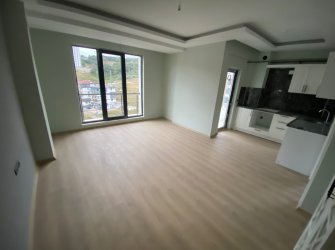 SAMSUN ATAKUM KURUPELİT MH 1+1 5.KAT 55m2 YERDEN ISITMALI ÖZEL YAPIM GENİŞ BALKONLU SIFIR FIRSAT DAİRE