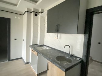 SAMSUN ATAKUM KURUPELİT MH 1+1 5.KAT 60m2 YERDEN ISITMALI GENİŞ BALKONLU SIFIR FIRSAT DAİRE 