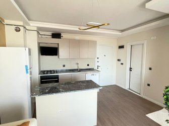 SAMSUN ATAKUM YENİMAHALLE MAH 1+1 50m2 YERDEN ISITMALI SIFIR EŞYALI GENİŞ BALKONLU SON 3 DAİRE