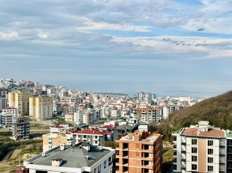 SAMSUN ATAKUM KÖRFEZ MH 1+1 55 m2 KAT VE CEPHE SEÇENEKLİ DENİZ, ŞEHİR VE DOĞA MANZARALI YERDEN ISITMALI HAVUZLU KAMELYALI GENİŞ BALKONLU KREDİYE UYGUN LÜKS DAİRELER