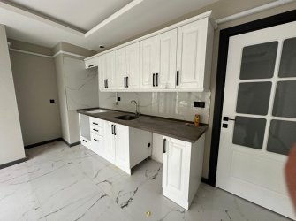 SAMSUN CANİK HASKÖY MAH 2+1 80m2 AMERİKAN MUTFAK BALKONLU OTOPARKLI YERDEN ISITMALI VESTİYER TAKILI YÜKSEK GİRİŞ SIFIR DAİRE